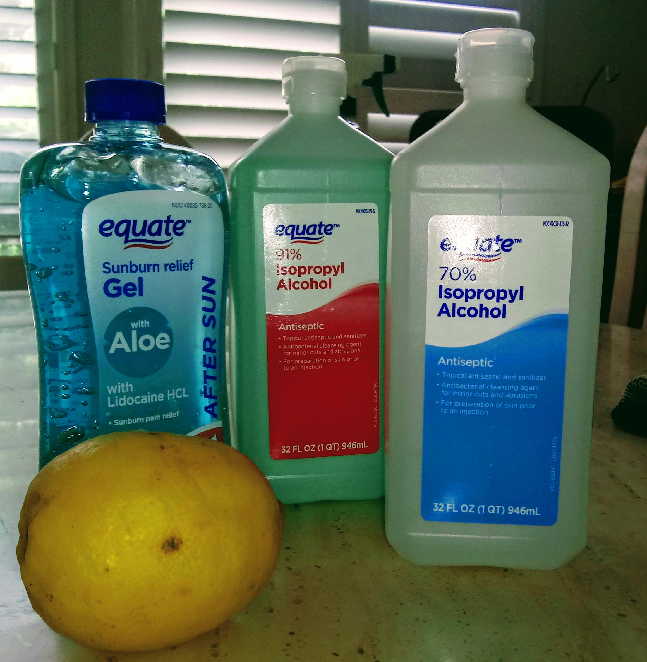 three-bottles-of-rubbing-alcohol-next-to-a-lemon